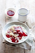 Rice pudding with wild berry compote and almonds