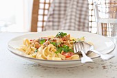 Chicken ragout with cream, tomatoes, Italian herbs and parsley on tagliatelle