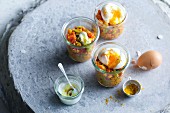 Eggs in glasses with curried lentils