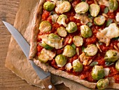 Wholemeal pizza with Brussels sprouts and pine nuts