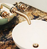 Close up of sink and bronze tap