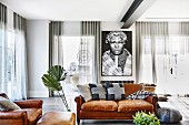 African picture in the living room with leather sofa