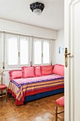 Flounced scatter cushions on couch in guest room