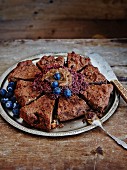 Gluten-free chocolate mudcake with nuts and blueberries