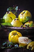 Fresh quinces, whole and halved