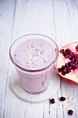 Pomegranate & yoghurt shake with desiccated coconut