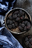 Blackberries in metal dishes