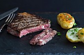 Sirloin steak with baked potatoes