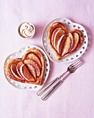 Heart-shaped pastries with apple wedges
