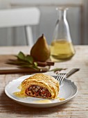 Bavarian blood sausage strudel with pear sauce