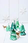 Christmas trees made from egg boxes and deer figurine