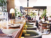 Guests and waiters at the restaurant Tashas in South Africa