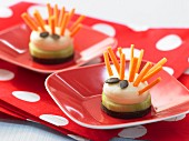 Cheese hedgehogs with carrot stick prickles and pumpkin seed eyes