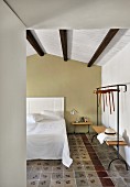 Mediterranean hotel room with traditional tiled floor in restored period building