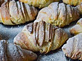 Home-made croissants dusted with icing sugar