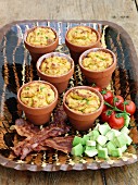Cornbreads in flowerpots with bacon and avocado