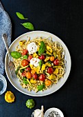 Spaghetti with anchovy paste, sautéed vegetables, burrata and basil