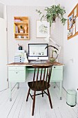 Shelf and hanging basket above old desk and Windsor chair