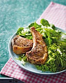 Grilled lamb chops with mint and pea puree and spinach leaves