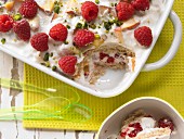 A layered fruit yoghurt dessert with raspberries and nectarines