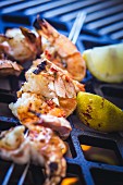 Grilled shrimps on the barbecue (close-up)