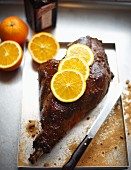 Leg of venison with Cointreau and orange slices