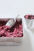Blueberry granita in a metal tin and a metal cup