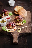 Vegan burger with cucumber relish, ketchup, mustard and red onions