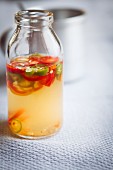Vegan chilli sauce in a glass bottle