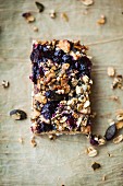 An oatmeal bar with blueberries and pumpkin seeds (Superfood)