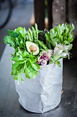 Green superfood vegetables in a paper bag