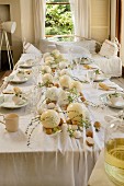 Easter table set with ostrich eggs and hens' eggs