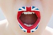 A female mouth with a Union Jack lipstick design