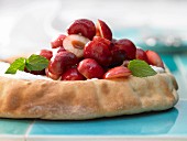 Yeast dough topped with quark and cherries
