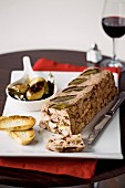 Pork & chicken terrine with prunes and balsamic onions