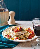 Tagliatelle with Mediterranean vegetables, fish, garlic and tomatoes