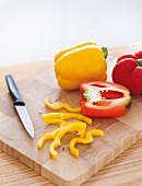 Yellow and red pepper on a chopping board