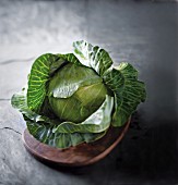 A head of cabbage on a wooden board