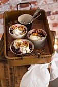 Caramel ice cream with cherry compote and salty pretzel-shaped biscuits
