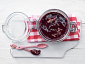 Sweet berry jam with almonds