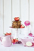 Spelt pancakes with strawberries and chocolate sauce
