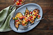 Grilled aubergine with tomato and basil