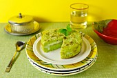 A potato cake with fresh pesto and a cheese filling