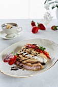 Pancakes with fresh cheese, berry quark, fresh fruits and chocolate sauce
