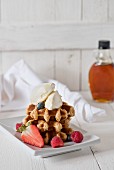 Waffles with mascarpone, berries and maple syrup
