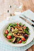 Spinach salad with artichokes and tomatoes