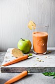 A glass of carrot, apple and ginger juice