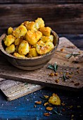 Roast potatoes with a polenta crust, Parmesan and rosemary