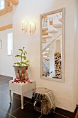 Hallway festively decorated with gnomes and small Christmas tree with fairy lights