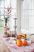 Festive snacks on table in front of window